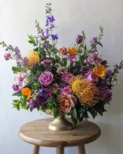 Load image into Gallery viewer, Lavish floral arrangement in gold compote vase