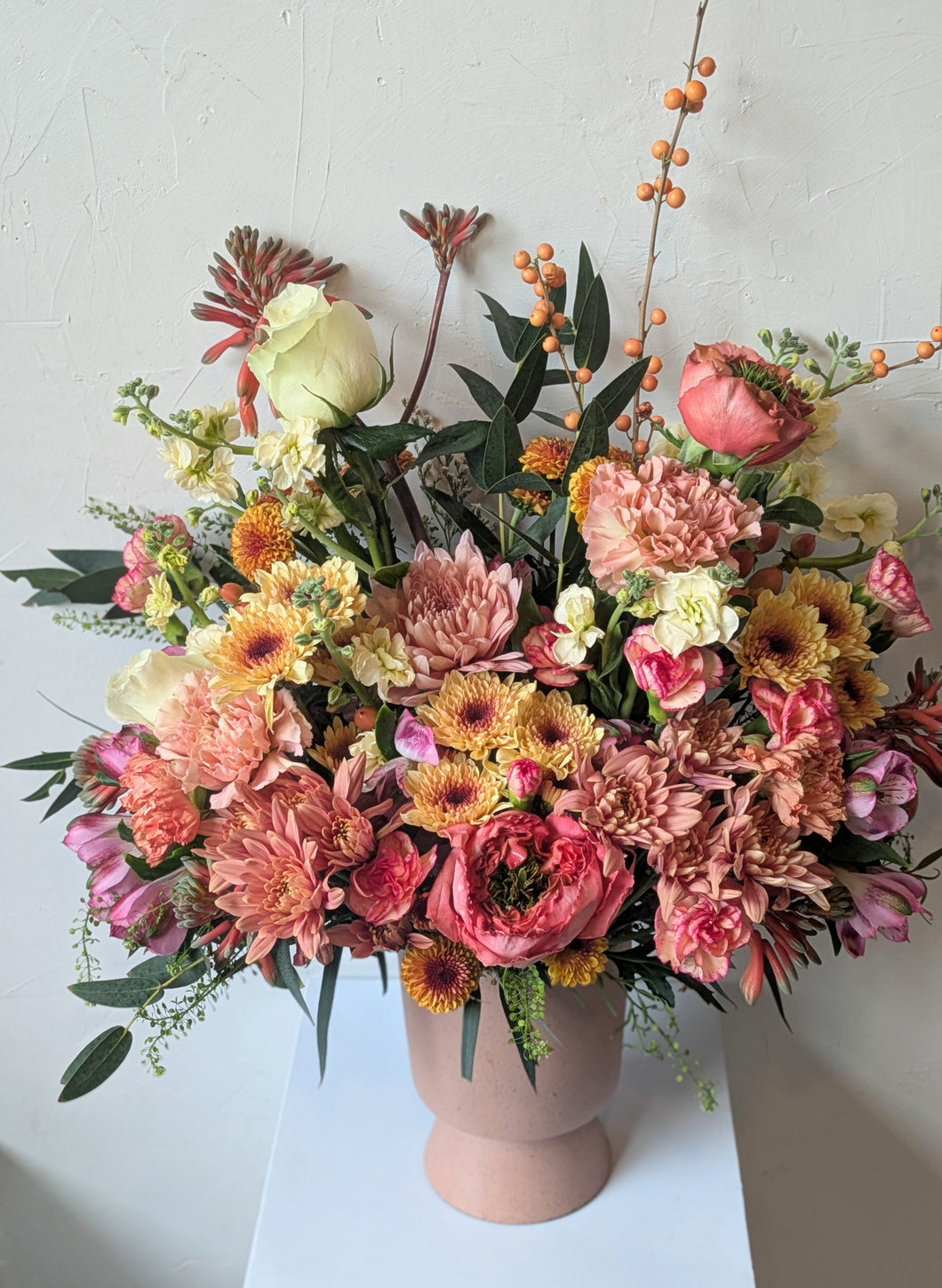 Artisan flower arrangement in a modern ceramic vase for Local Flower Delivery